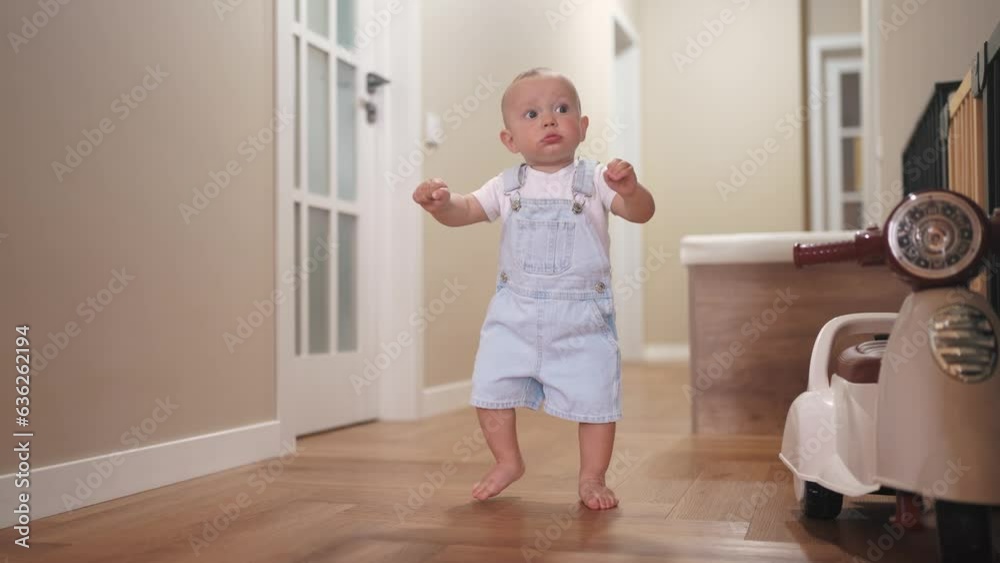 baby first steps. son a baby toddler learning to walk take first steps. happy family kid dream concept. baby indoors learning to walk lifestyle indoors. baby son training concept baby first steps. son a baby toddler learning to walk take first steps. happy family kid dream concept. baby indoors learning to walk lifestyle indoors. baby son training concept