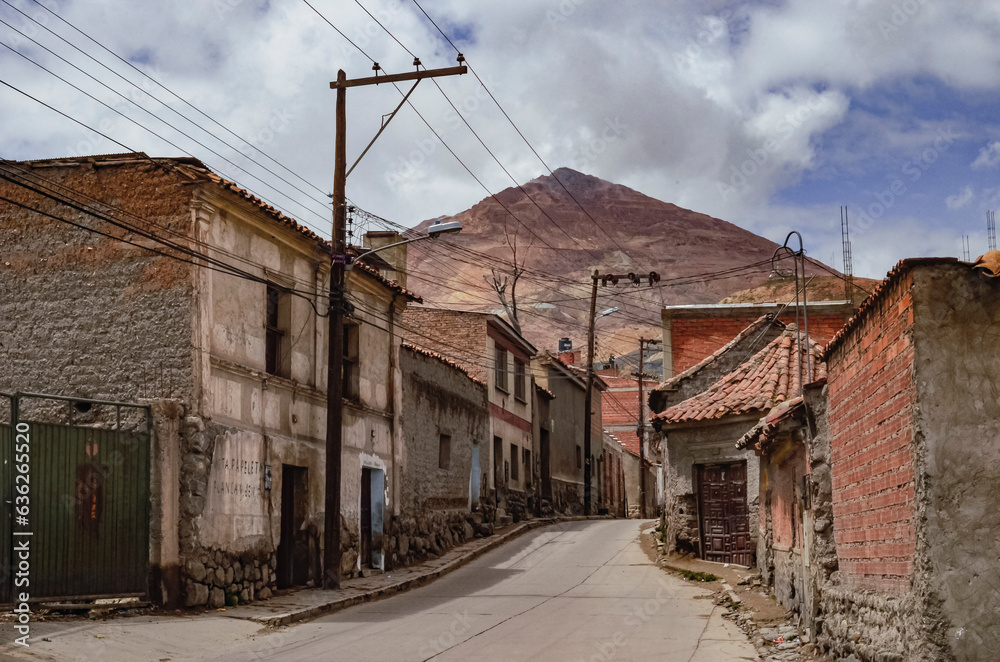 View of a lonely street in a neighborhood in Potosi with the Cerro Rico in the background. Bolivia citylandscape. Southamerica View of a lonely street in a neighborhood in Potosi with the Cerro Rico in the background. Bolivia citylandscape. Southamerica