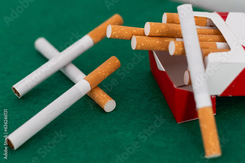 Heap of cigarettes on black background. Close up.