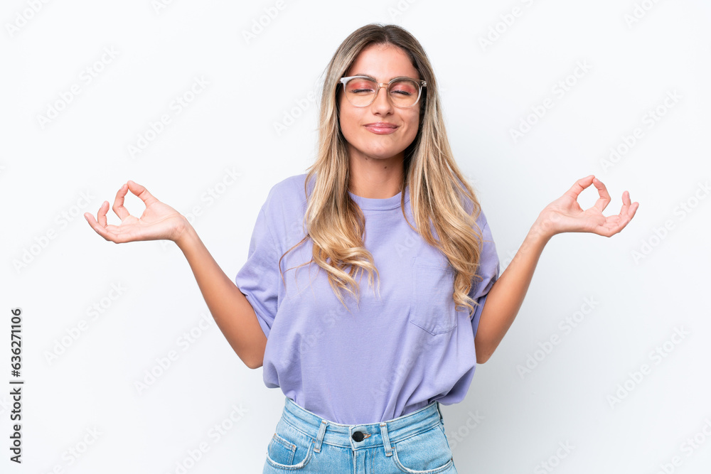 Young Uruguayan woman isolated on white background in zen pose Young Uruguayan woman isolated on white background in zen pose