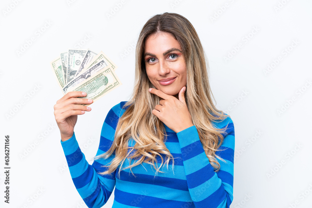 Young Uruguayan woman taking a lot of money isolated on white background thinking Young Uruguayan woman taking a lot of money isolated on white background thinking