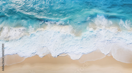 Overhead photo of crashing waves on the shoreline beach. Tropical beach surf. Abstract aerial ocean view