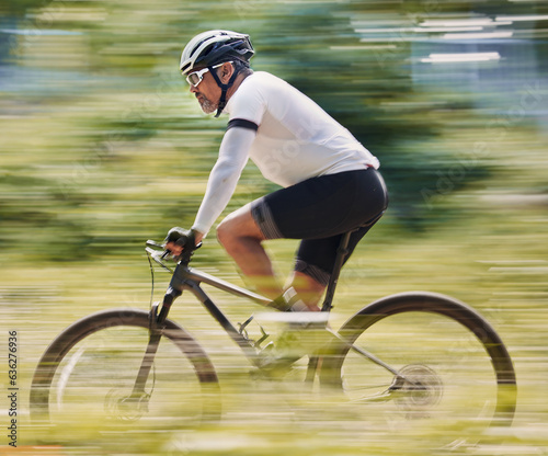 Fitness, freedom and man cycling in forest for speed, training or nature, workout and off road race. Energy, workout and cyclist on mountain bike for extreme sports, adrenaline or power performance