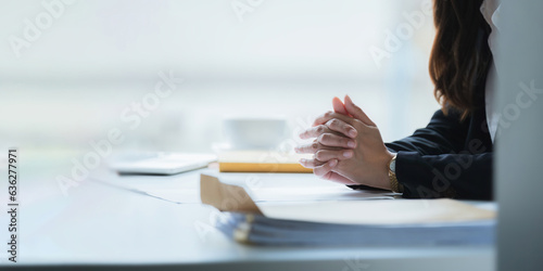Photography Close up clasped hands businesswomen negotiate at table, confrontation concept,