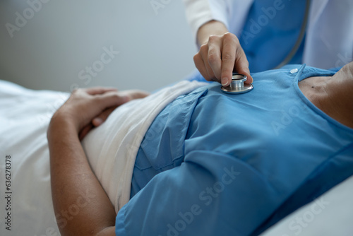 doctor checking patient blood pressure