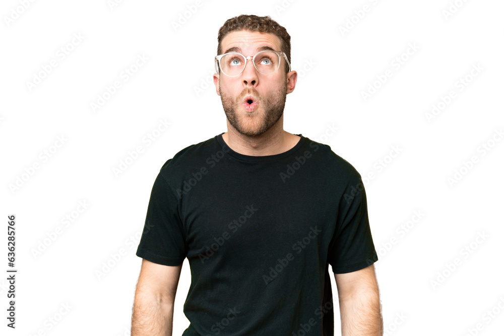 Fototapeta premium Young handsome blonde man over isolated chroma key background looking up and with surprised expression