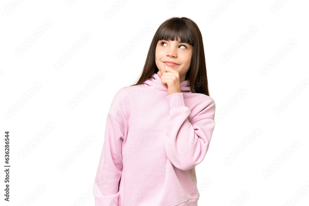 Little girl over isolated green chroma key background and looking up Little girl over isolated green chroma key background and looking up