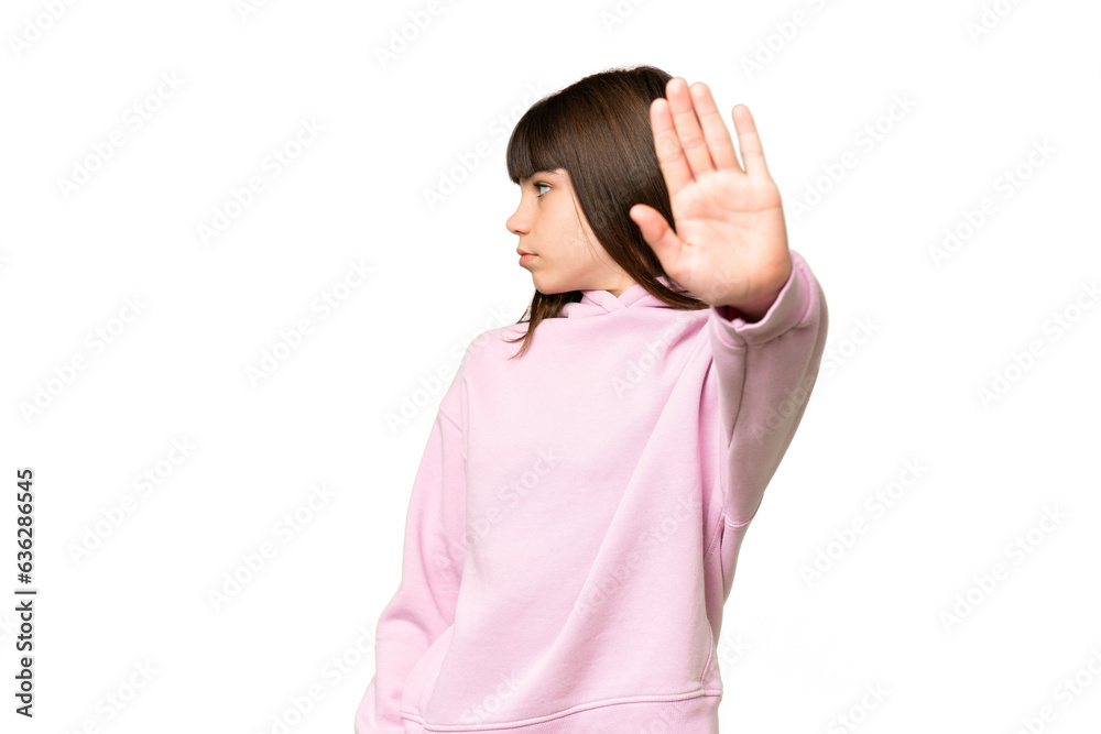 Little girl over isolated green chroma key background making stop gesture and disappointed Little girl over isolated green chroma key background making stop gesture and disappointed
