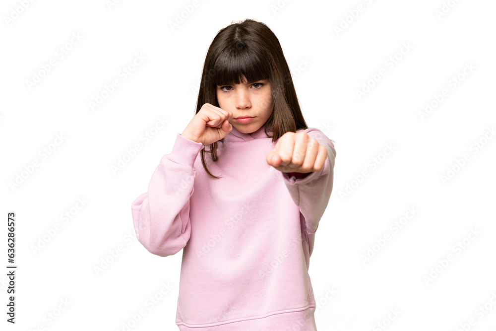 Little girl over isolated green chroma key background with fighting gesture