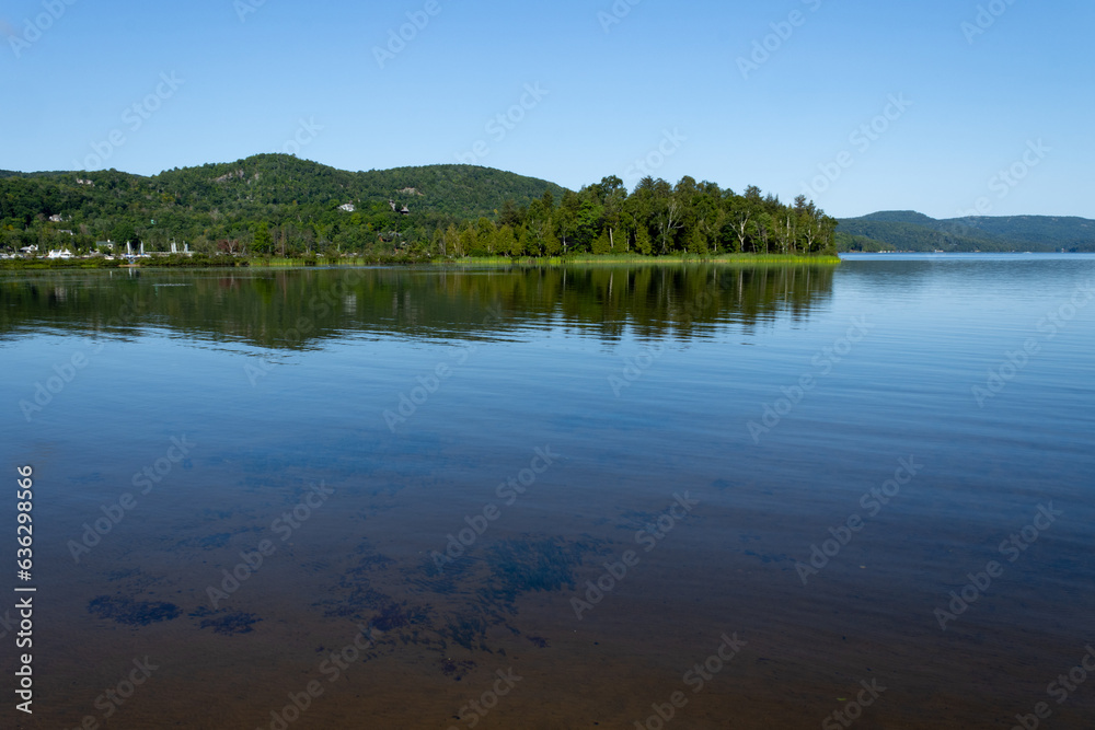 Shallow - a view of a shallow lake with sand clearly visible through the water