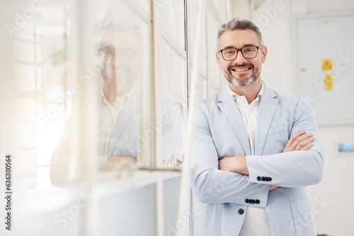 Smile, executive and portrait of a businessman with arms crossed in an office for professional pride. Happy, corporate and a mature manager or ceo working with confidence in workplace management photo