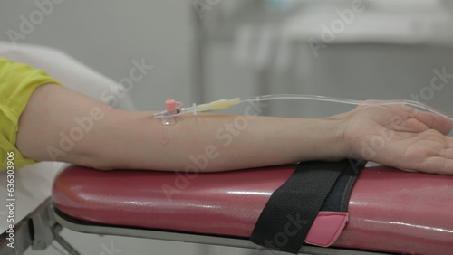 Close-up of a female physiotherapist doing an injection to her patient