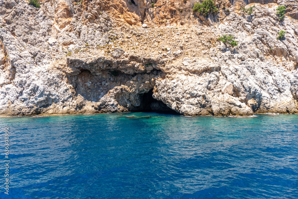Sea waves and fantastic rocky coast diving place cave Alanya Turkey 