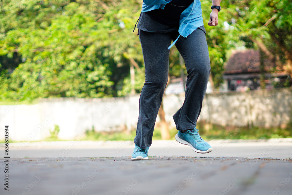 Side view of a jogger legs running. Workout and healthy life concept Side view of a jogger legs running. Workout and healthy life concept