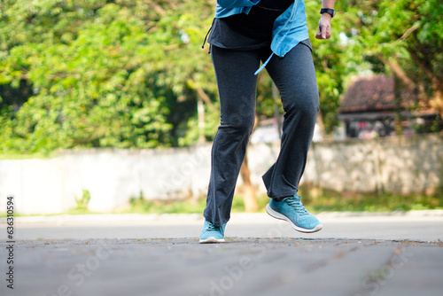 Side view of a jogger legs running. Workout and healthy life concept