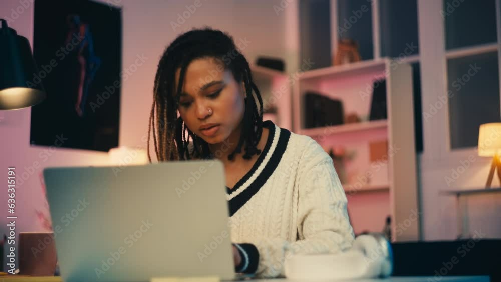 Concentrated female blogger typing on laptop at home, social networks and work Concentrated female blogger typing on laptop at home, social networks and work