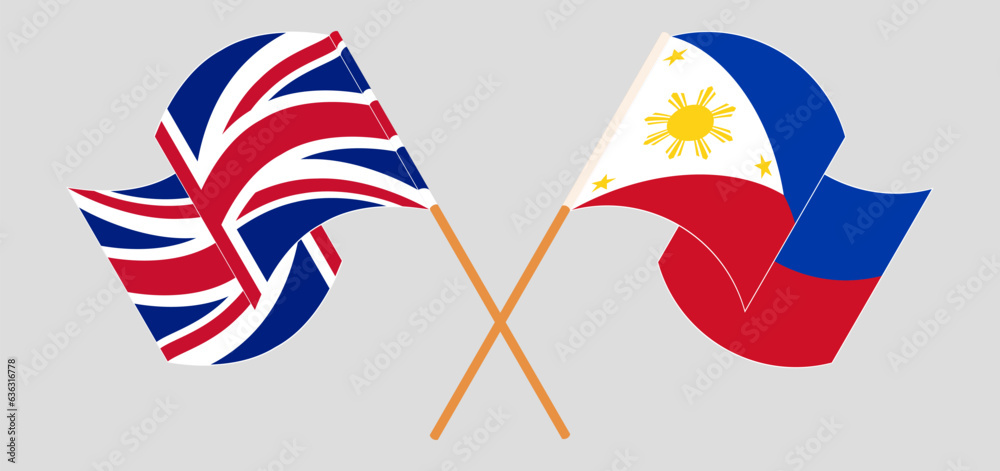 Crossed and waving flags of United Kingdom and the Philippines Crossed and waving flags of United Kingdom and the Philippines