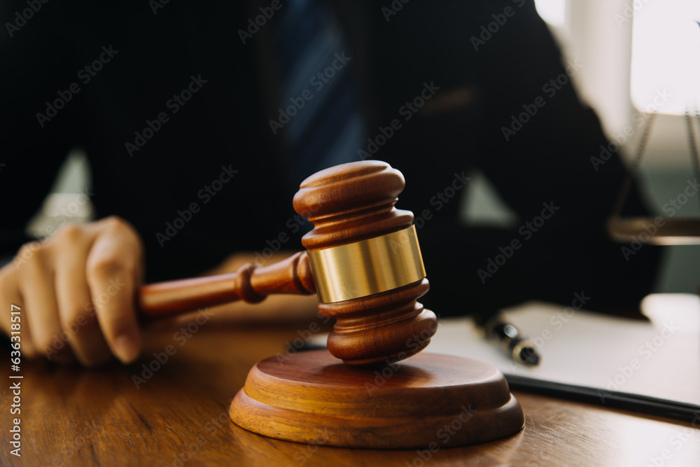Businessman and Male lawyer or judge consult having team meeting with client, Law and Legal services concept. Businessman and Male lawyer or judge consult having team meeting with client, Law and Legal services concept.