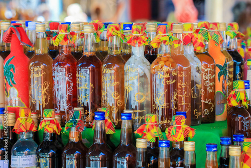 Colorful Gift Souvenir Bottles with the different Drinks on the Local Market, Guadeloupe