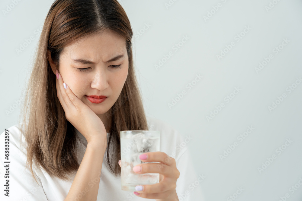 Asian woman feel sensitive teeth after drinking cold, female suffer tooth, decay problems, dental care, tooth extraction, decay problem, bad breath, Gingival Recession, Oral Hygiene instruction. Asian woman feel sensitive teeth after drinking cold, female suffer tooth, decay problems, dental care, tooth extraction, decay problem, bad breath, Gingival Recession, Oral Hygiene instruction.