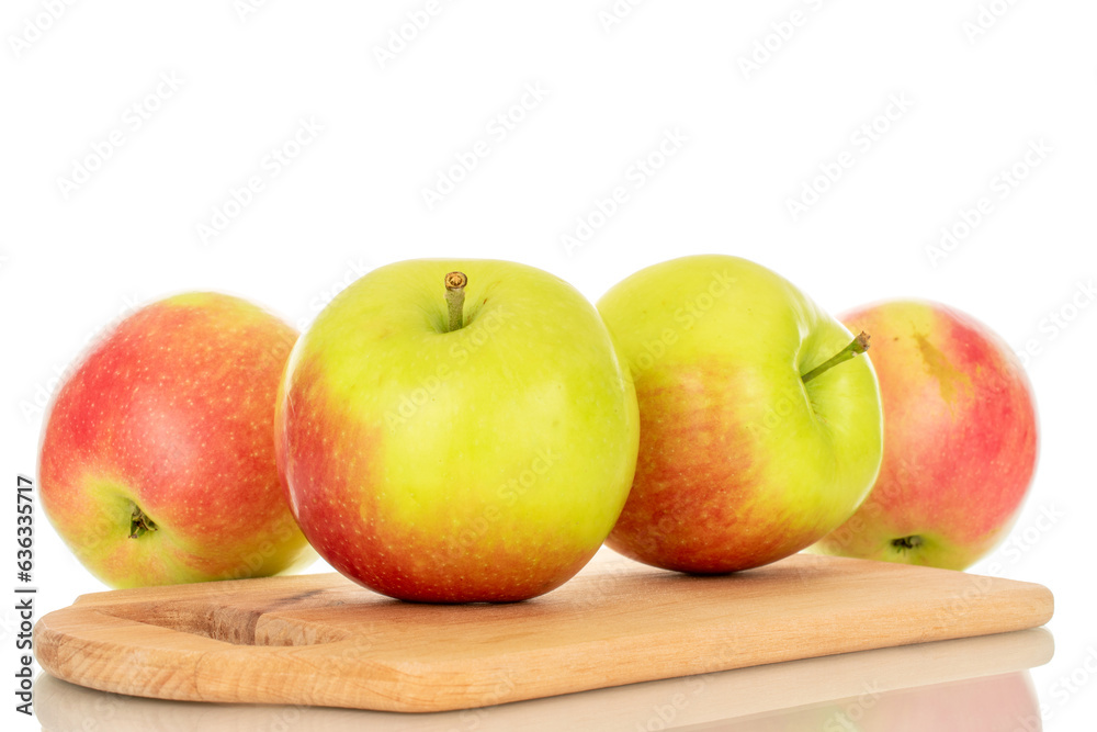 Several sweet juicy apples on a wooden kitchen board, macro, isolated on white background. Several sweet juicy apples on a wooden kitchen board, macro, isolated on white background.