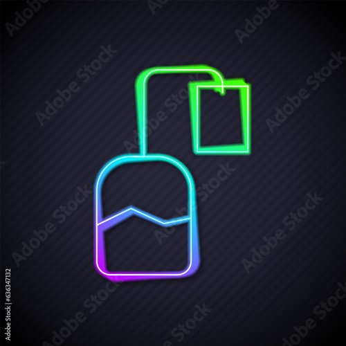 Glowing neon line Tea bag icon isolated on black background. Vector