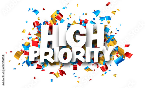 High priority sign over colorful cut out foil ribbon confetti background.