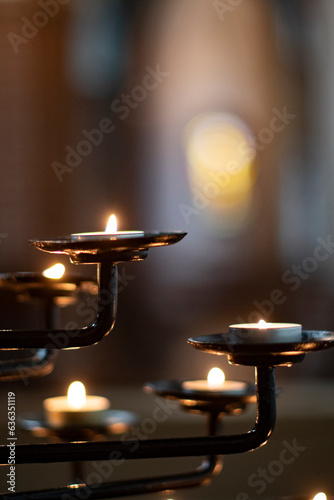 Holy candlelight in an old Scandinvian church, closeup