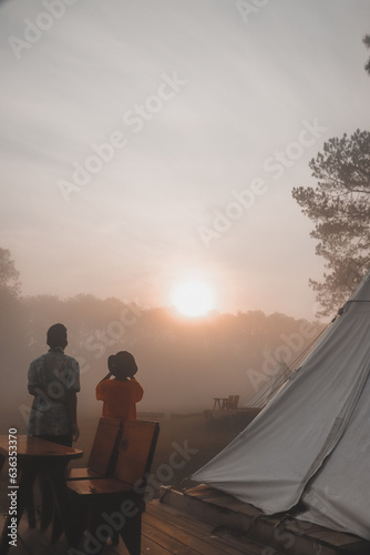 Two boys on a dry field Misty morning at Thung Salaeng Luang National Park  Phitsanulok Province  Thailand