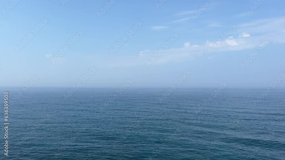 Blue sea and sky with clouds.
Blue sea and sky with clouds.