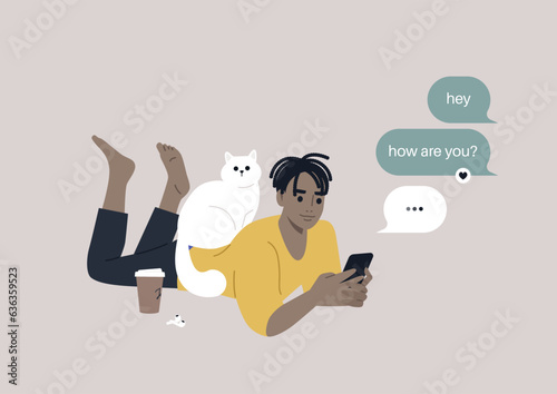 A youthful character reclining on their stomach, engrossed in checking their mobile phone's messenger app, meanwhile, a cat perches on their back, seeking attention