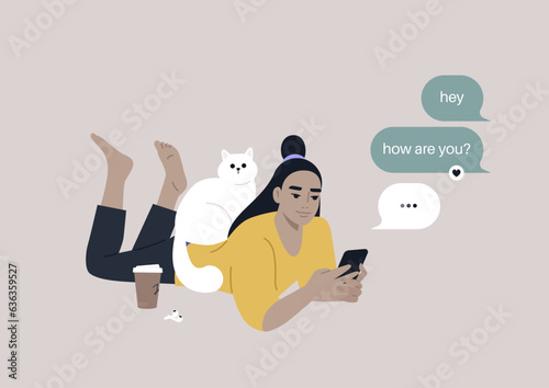 A youthful character reclining on their stomach, engrossed in checking their mobile phone's messenger app, meanwhile, a cat perches on their back, seeking attention
