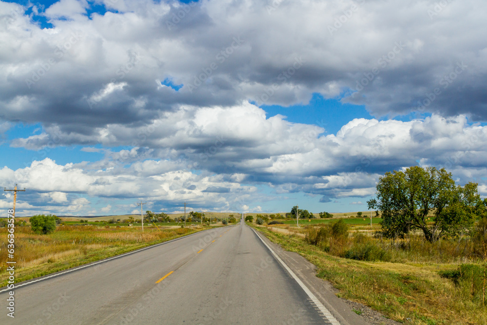 Endless Horizon: Tranquil Countryside Road Amidst Open Prairie South Dakota