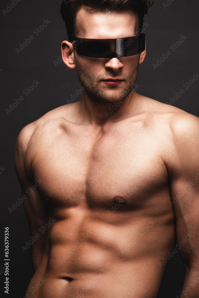 Fototapeta premium Male beauty concept. Portrait of handsome young man. Perfect hair and skin. Studio shot
