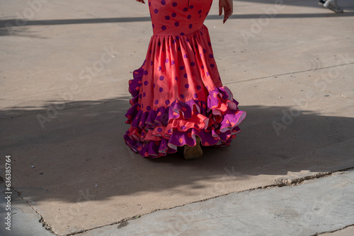 Dance with the spirit of Spain in a flamenco dress. Polka dots embellish this traditional wear, resonating with the rhythms and culture of Andalusian folklore.