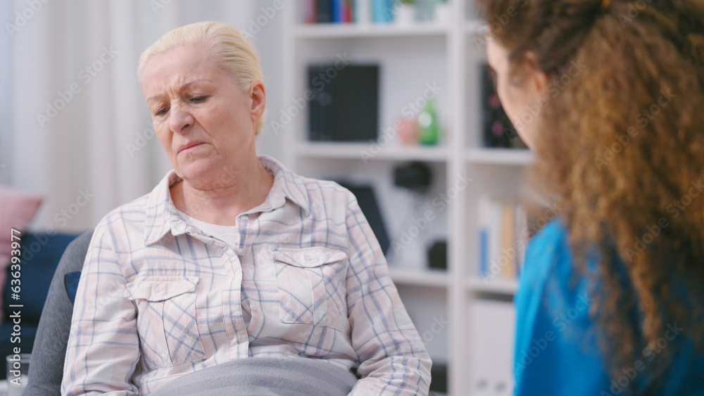 Lonely senior woman feeling sadness, refusing to talk and take medication Lonely senior woman feeling sadness, refusing to talk and take medication