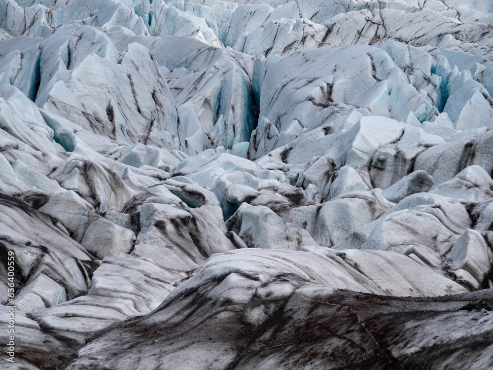 Breathtaking landscape featuring snow-capped mountains and a glacier with rocky outcroppings Breathtaking landscape featuring snow-capped mountains and a glacier with rocky outcroppings