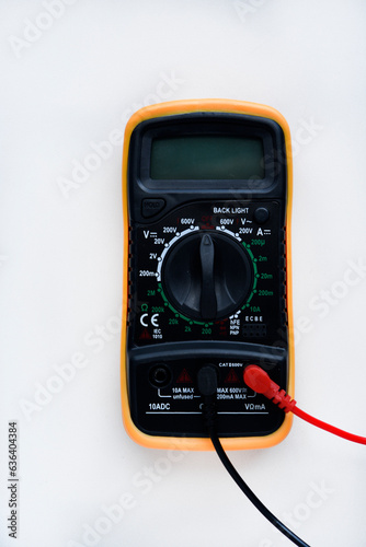 Multimeter on a white background. Voltage and current meter.