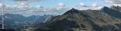 Fototapeta Naklejka Na Ścianę i Meble -  Panoramic View Of A Valley And Mountain Range In Summer