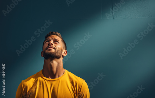 Contrasting Hues of Labor: Young Man in Slumped T-Shirts, Marrying Dark Blue and Sky-Blue, Exemplifying Laborwave, Organic Minimalism, and Carpetpunk Aesthetics photo