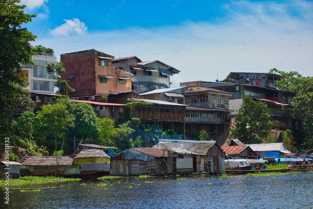 Scenic view of a river passing through a bustling cityscape: Iquitos, Peru, Amazon Scenic view of a river passing through a bustling cityscape: Iquitos, Peru, Amazon