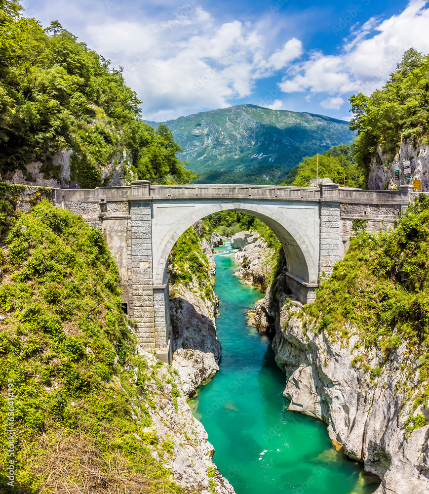 A view from the Soca river gorge towards the Napoleon Bridge near Kobarid, Slovenia in summertime