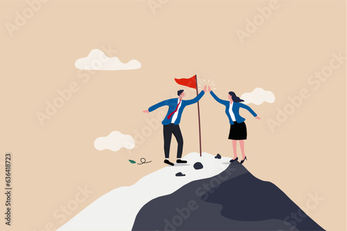 Success collaboration on top of mountain peak, business achievement, happy businessman and businesswoman, Red frag on top of mountain with snow peak with clouds in the background.