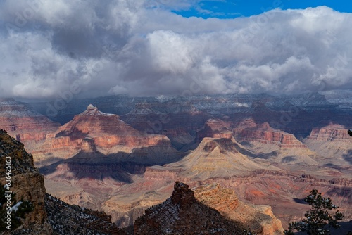 Aerial view of the beautiful Grand Canyon under a cloudy sky © Sheldon Hilde/Wirestock Creators