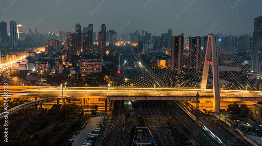 Aerial view of a bustling cityscape at night: Wuhan Zhuyeshan Interchange low exposure Aerial view of a bustling cityscape at night: Wuhan Zhuyeshan Interchange low exposure