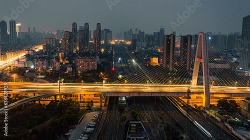 Aerial view of a bustling cityscape at night: Wuhan Zhuyeshan Interchange low exposure