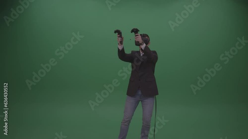 Young Handsome Man Drawing Virtual Painting Using Virtual Reality Glasses And Great Imagination On Green Screen Wall Background (ID: 636430552)