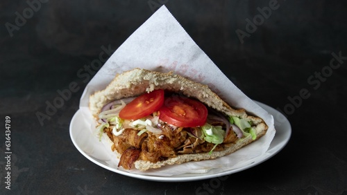 Berlin doner kebab with turkey and chicken, salad, tomatoes, vegetables and garlic sauce
