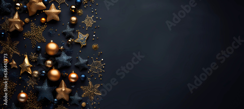 Christmas composition with Christmas balls and decorations on a black background with copy space.