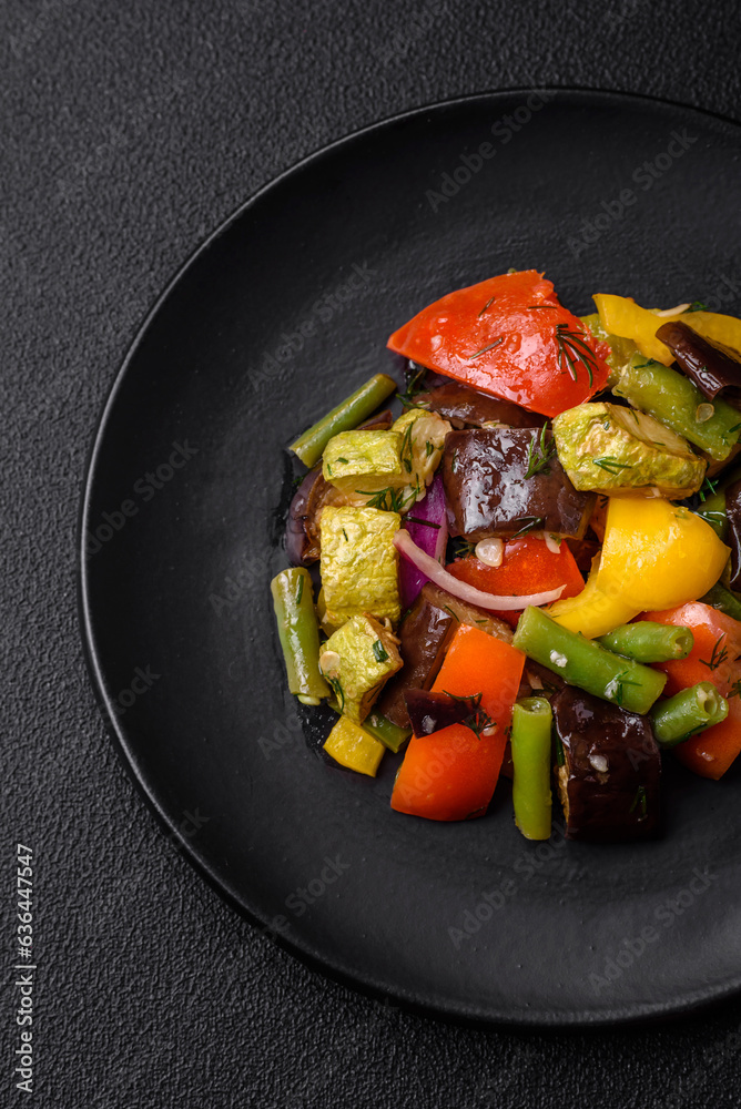 Delicious juicy fresh salad of baked eggplant, tomatoes, zucchini, onions